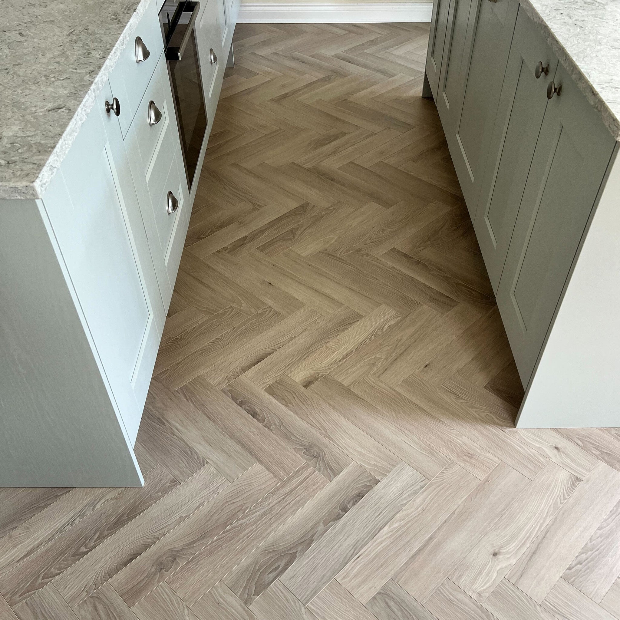 Malmo 12mm Herringbone Laminate - Floor Street
